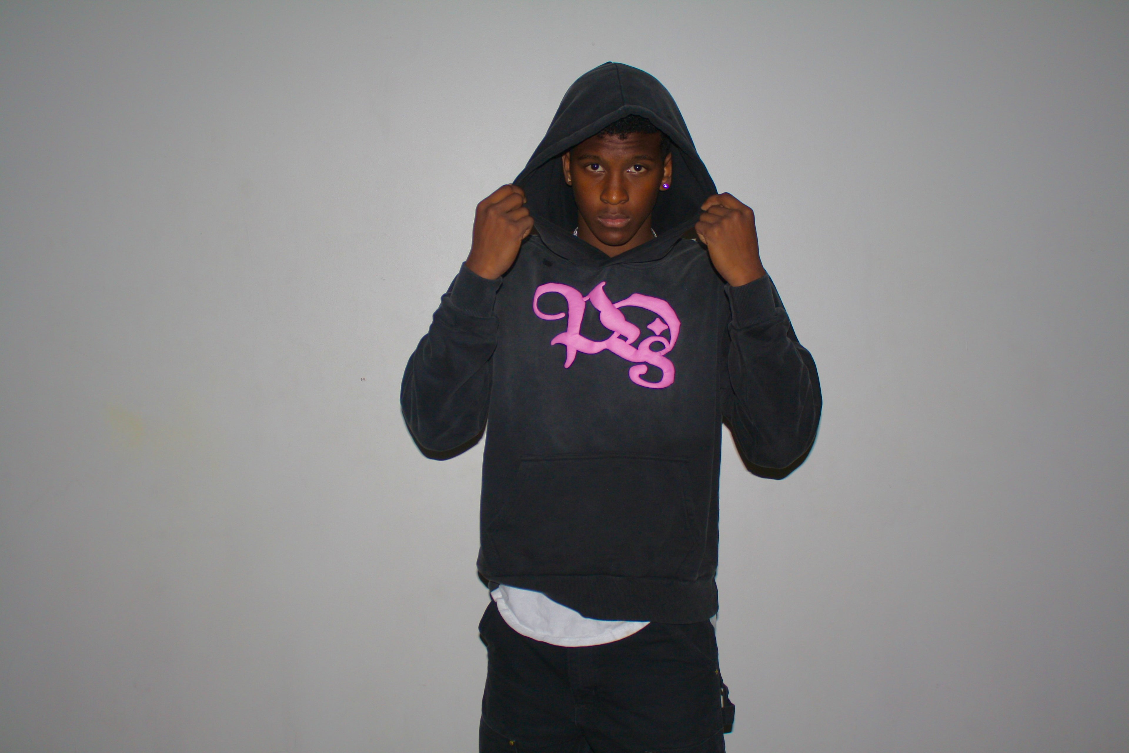 Stand Out Collective pink logo hoodie being modeled