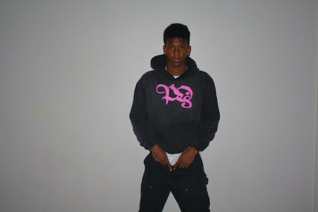 Stand Out Collective pink logo hoodie being modeled